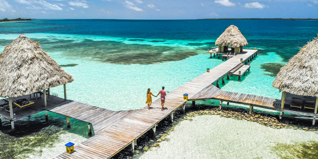 Hand in hand, where turquoise waters meet endless skies -- this is what forever feels like.