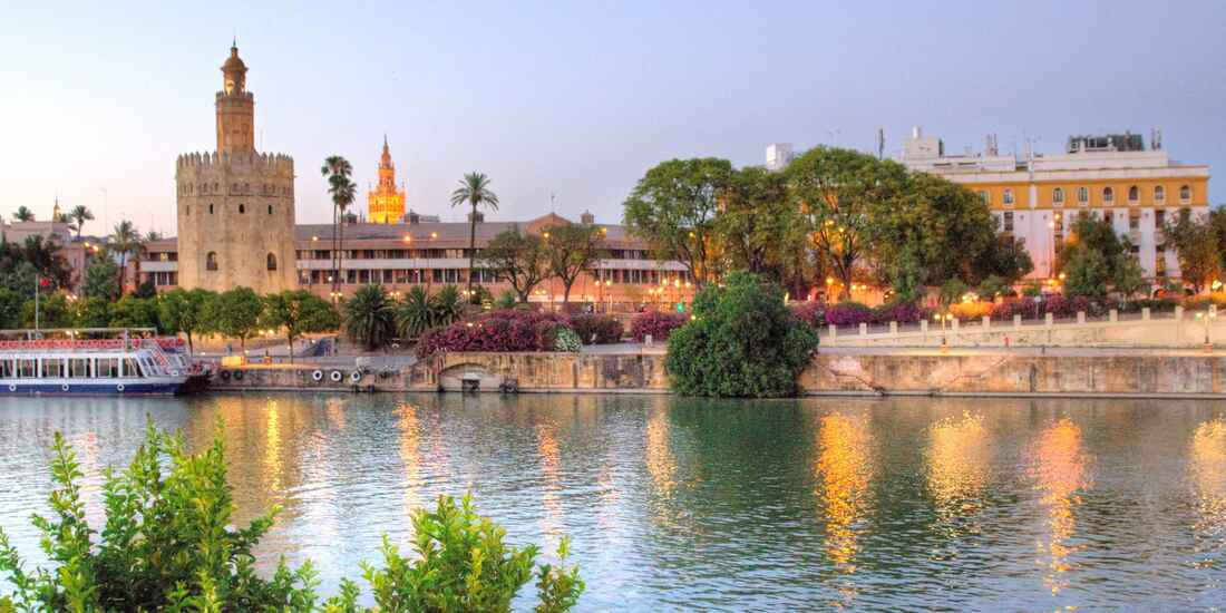 Evenings in Seville are pure magic--where the historic Torre del Oro reflects on the Guadalquivir River, blending Spain&rsquo;s golden past with its timeless charm.
