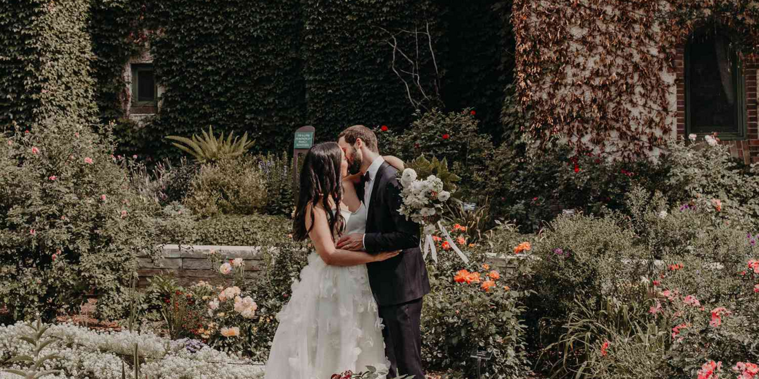 Romantic outdoor wedding reception with newlyweds toasting under twinkling lights -- the perfect destination wedding celebration filled with love and joy.