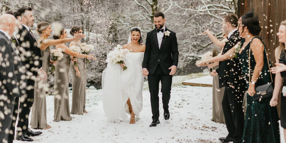 Winter ceremony with a backdrop of snowy outdoor scenery.