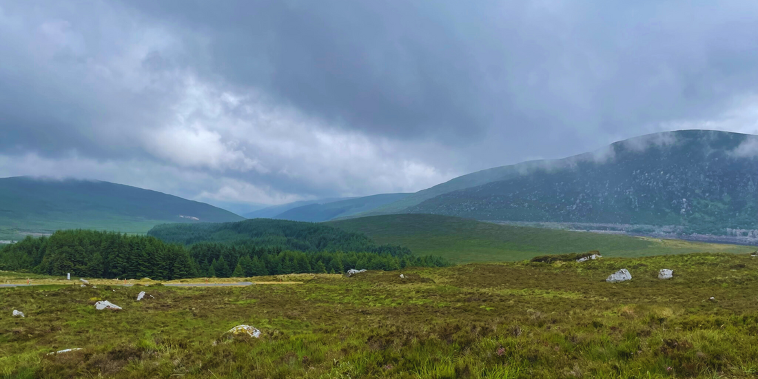Rolling Wicklow hills beneath drifting clouds, where Ireland&rsquo;s quiet beauty stretches wide and invites you to breathe a little deeper.