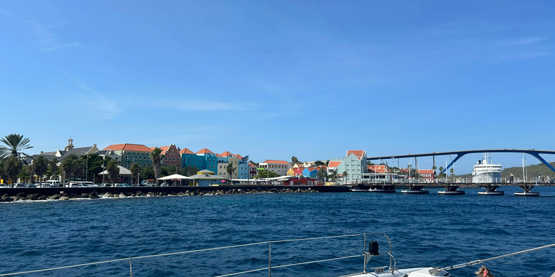 Willemstad waterfront with pastel buildings and blue Caribbean Sea.