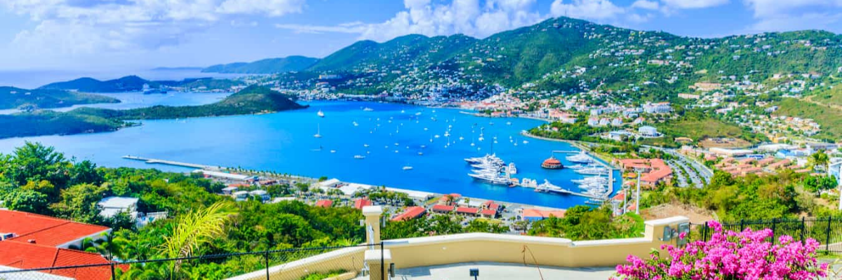 Panoramic view of St. John, U.S. Virgin Islands, featuring lush hills, turquoise bays, and neighboring Caribbean islands.